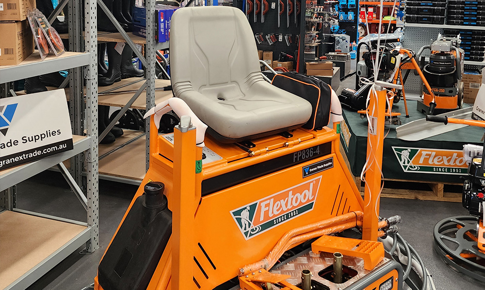 High performance Flextool petrol ride on power trowel for professional concrete finishing at Granex Trade.